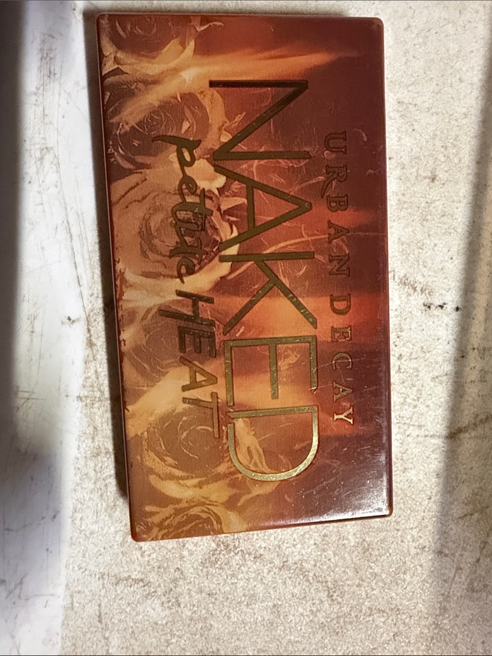 Urban Decay NAKED Decorative Wall Plaque in brown and orange tones
